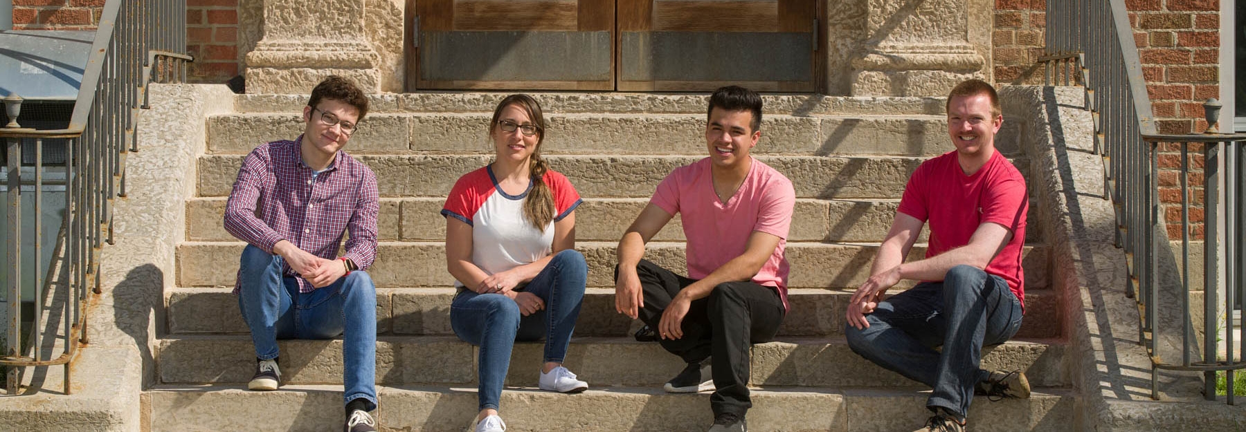Students sitting on concrete steps